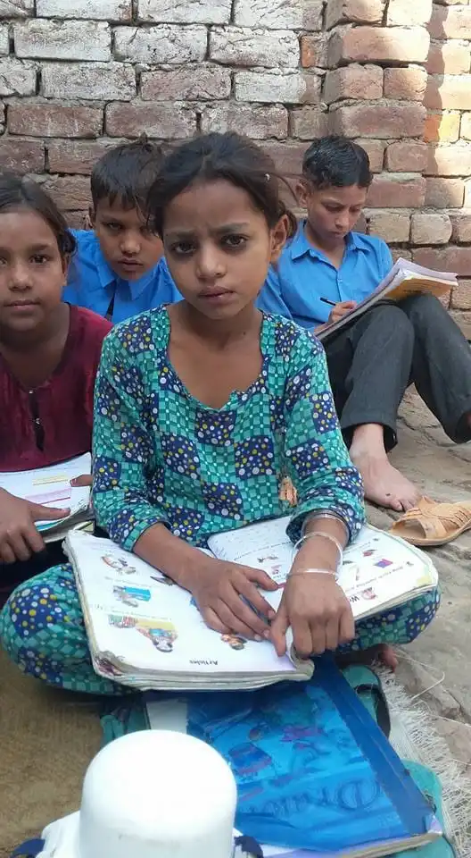 Distribution of school supplies to underprivileged children by ACC