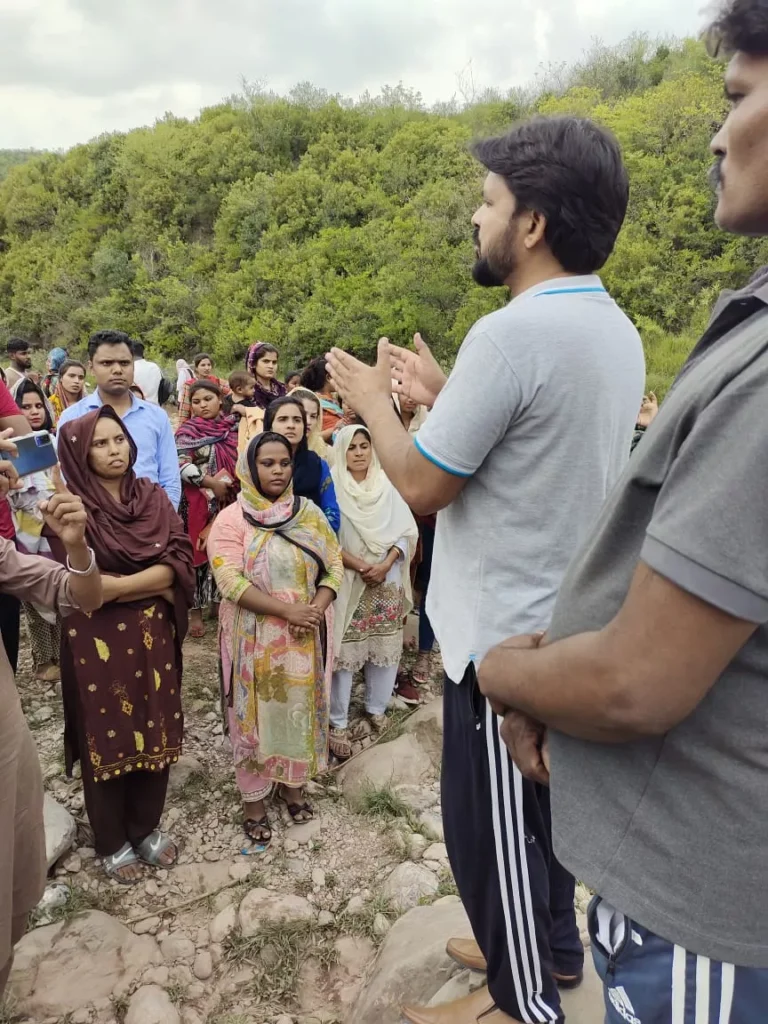 Church volunteers distributing monthly care packages to widows