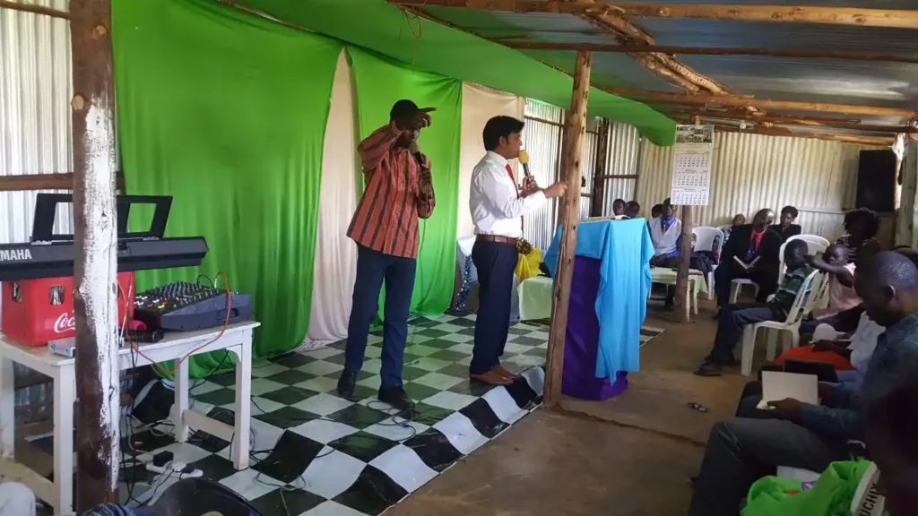 People in uganda listening word of God by bishop amanat